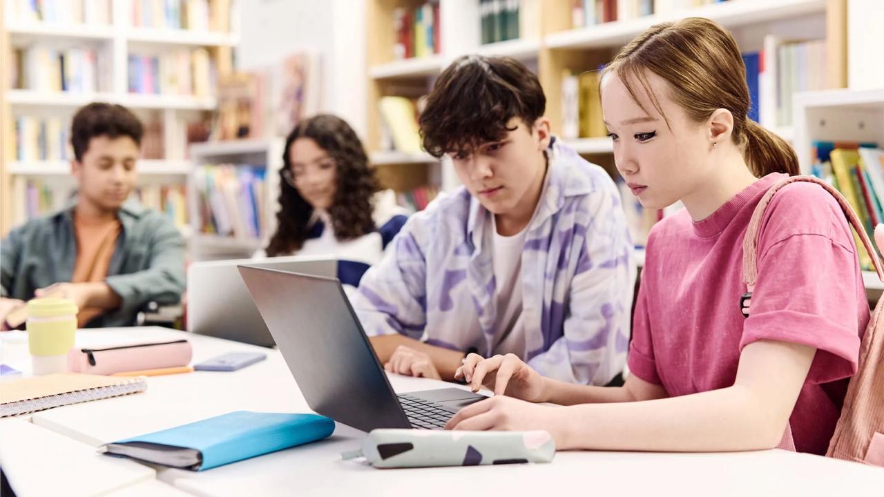 Student managing time with clock and planner